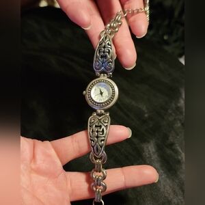 Detailed silver round face watch